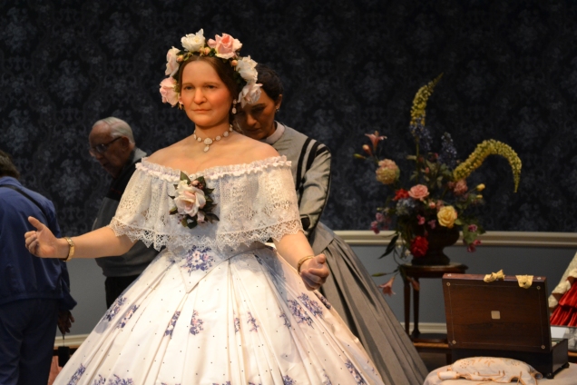 Mary being helped getting ready for an event